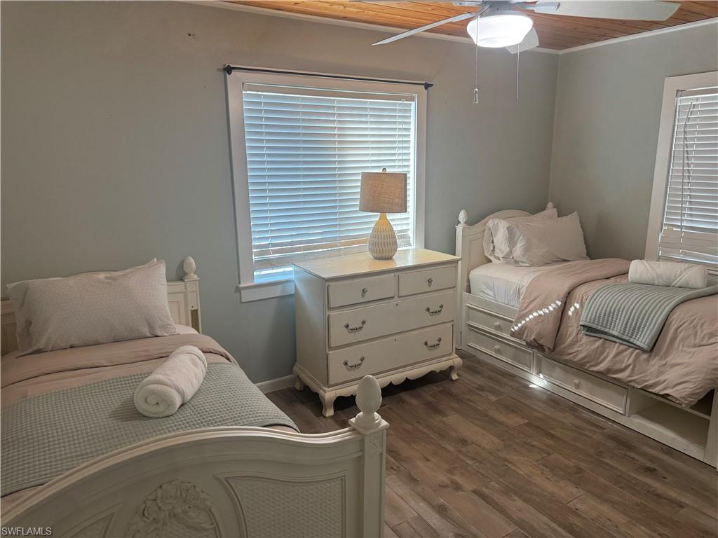 981 8th Terrace North Naples, FL 34102 - Photo 9 of 13 a bedroom with a bed and a window