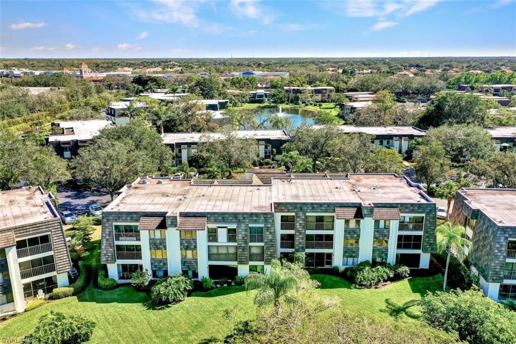 1617 Spoonbill Lane, Unit 1617 Naples, FL 34105 - Photo 26 of 31 an aerial view of multiple houses