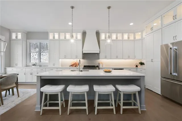 a dining table with chairs and window
