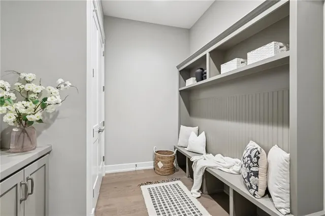 a living room with furniture and flowers