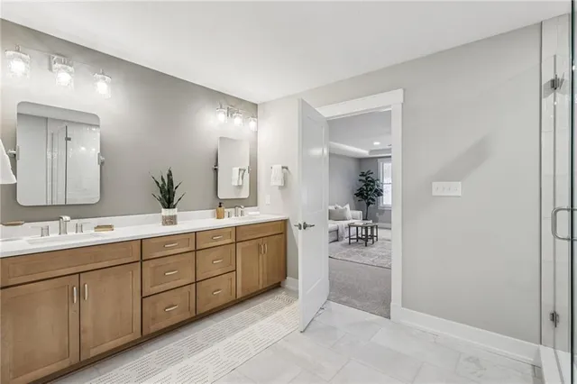 a bathroom with a double vanity sink and a mirror