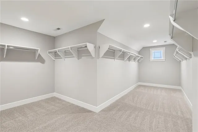 a view of an empty room with windows