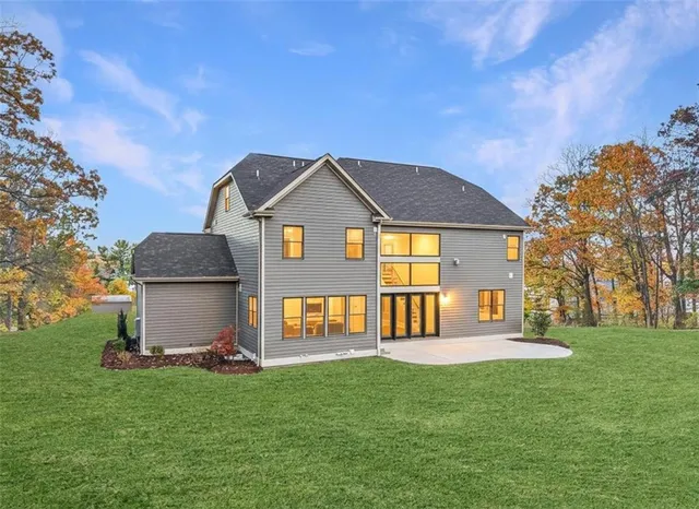a front view of a house with a yard