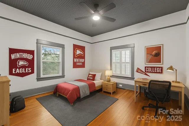 a bedroom with a bed and wooden furniture