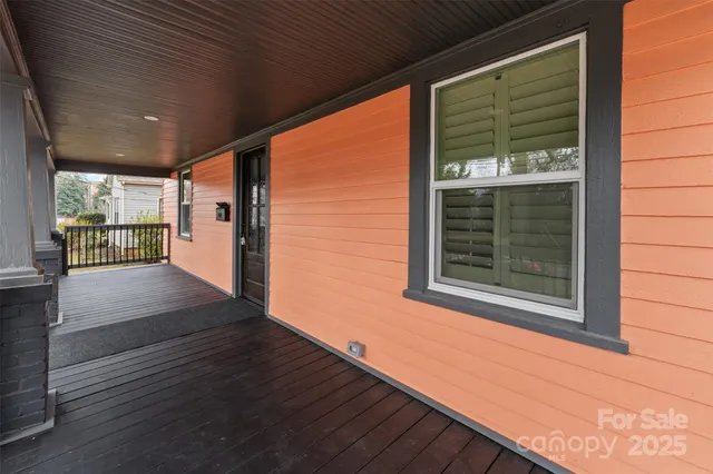 a view of outdoor space with wooden floor