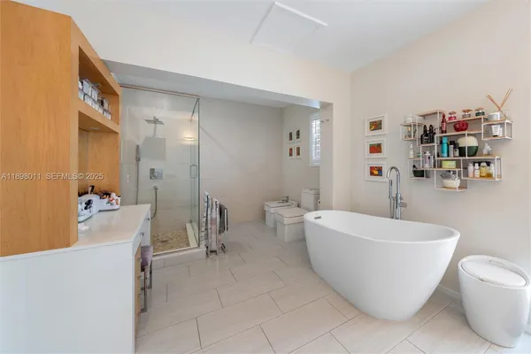 a spacious bathroom with a bathtub and toilet