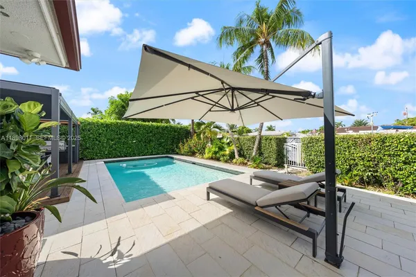 a view of swimming pool with a patio