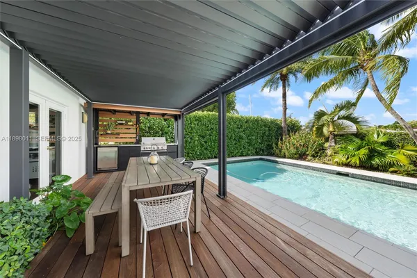 a view of balcony with furniture and garden