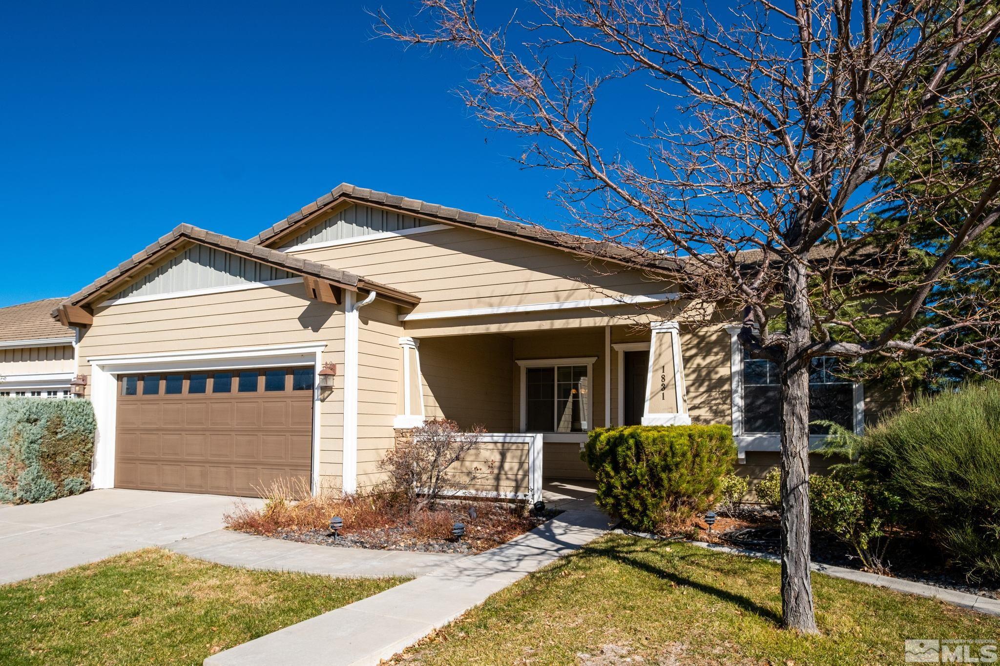 1831 Emerald Bay Drive Reno, NV 89521 - Photo 1 of 34 a front view of a house with garden