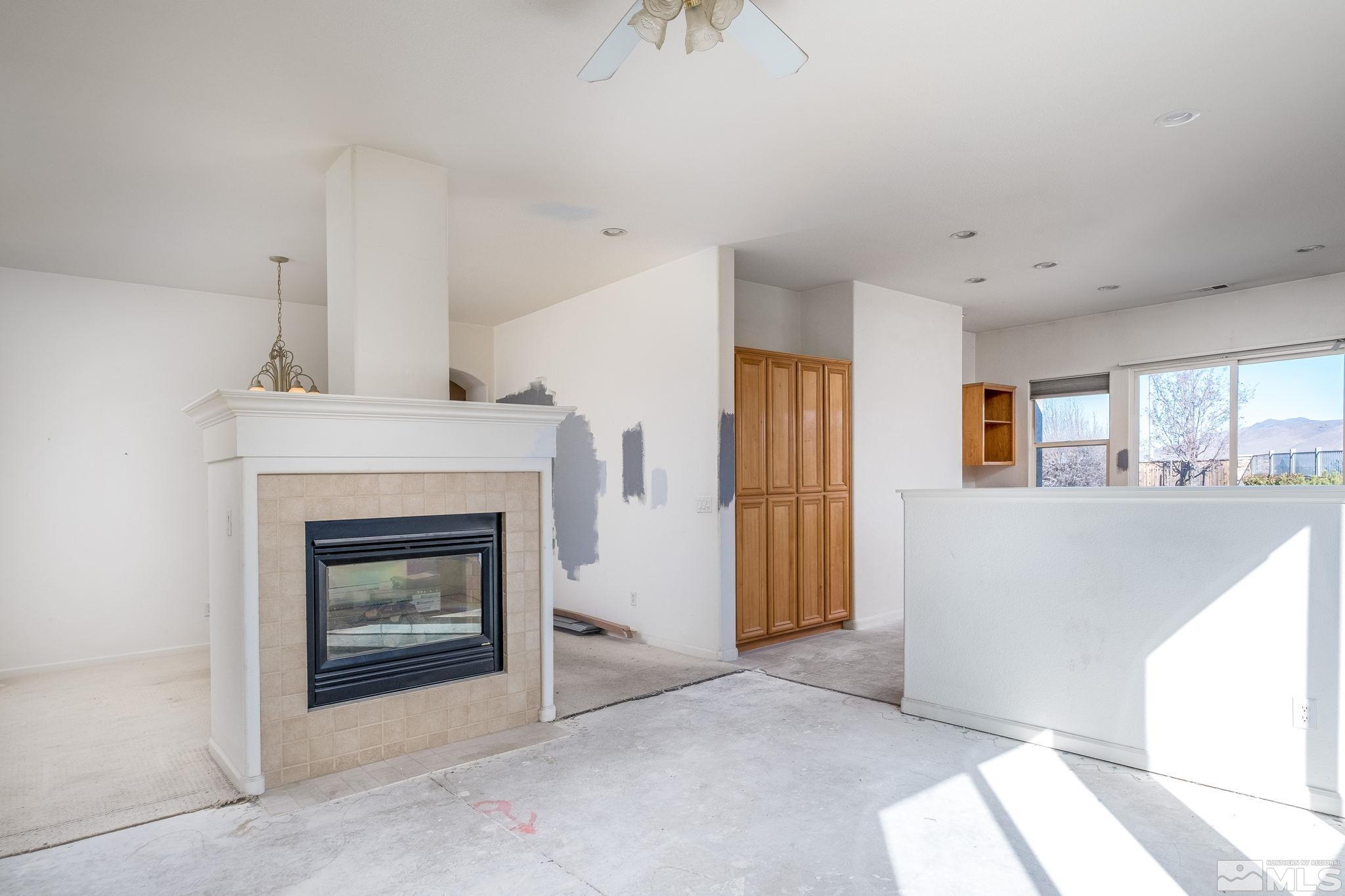 1831 Emerald Bay Drive Reno, NV 89521 - Photo 12 of 34 a view of a livingroom with an empty space and a fireplace