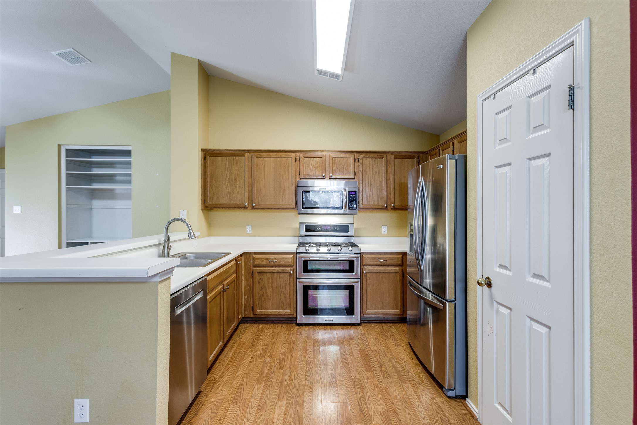 9057 Vigen Circle Austin, TX 78748 - Photo 12 of 27 a kitchen with stainless steel appliances granite countertop a stove and a refrigerator