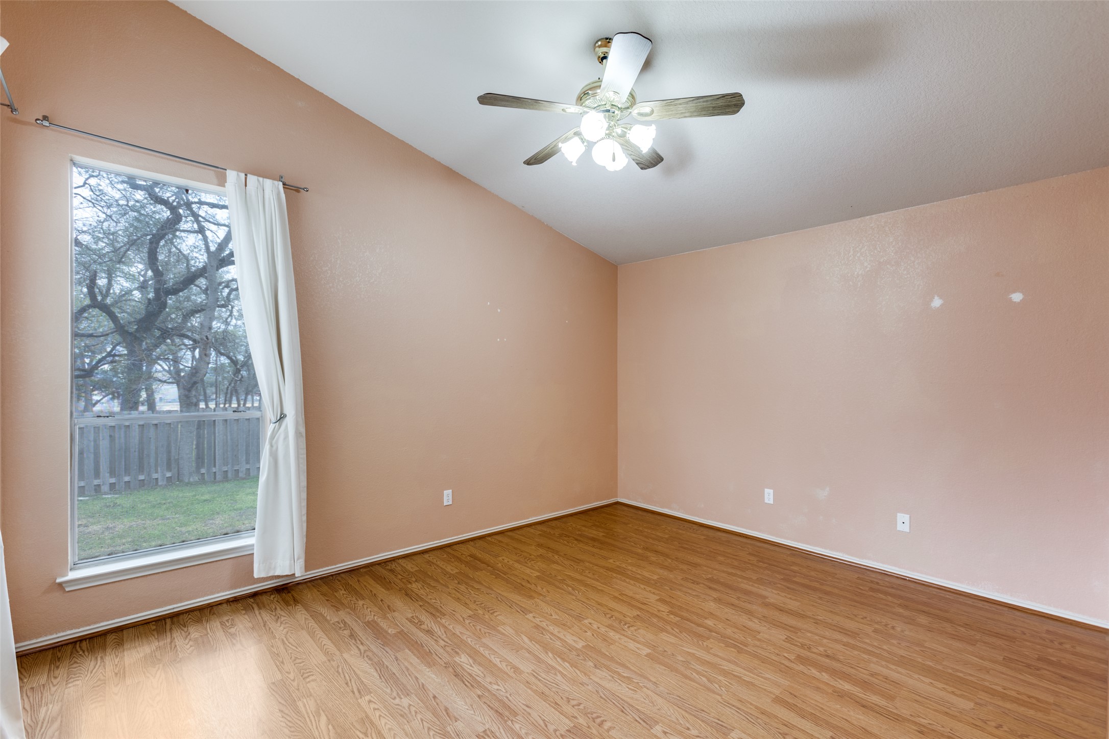9057 Vigen Circle Austin, TX 78748 - Photo 16 of 27 wooden floor in an empty room with a window