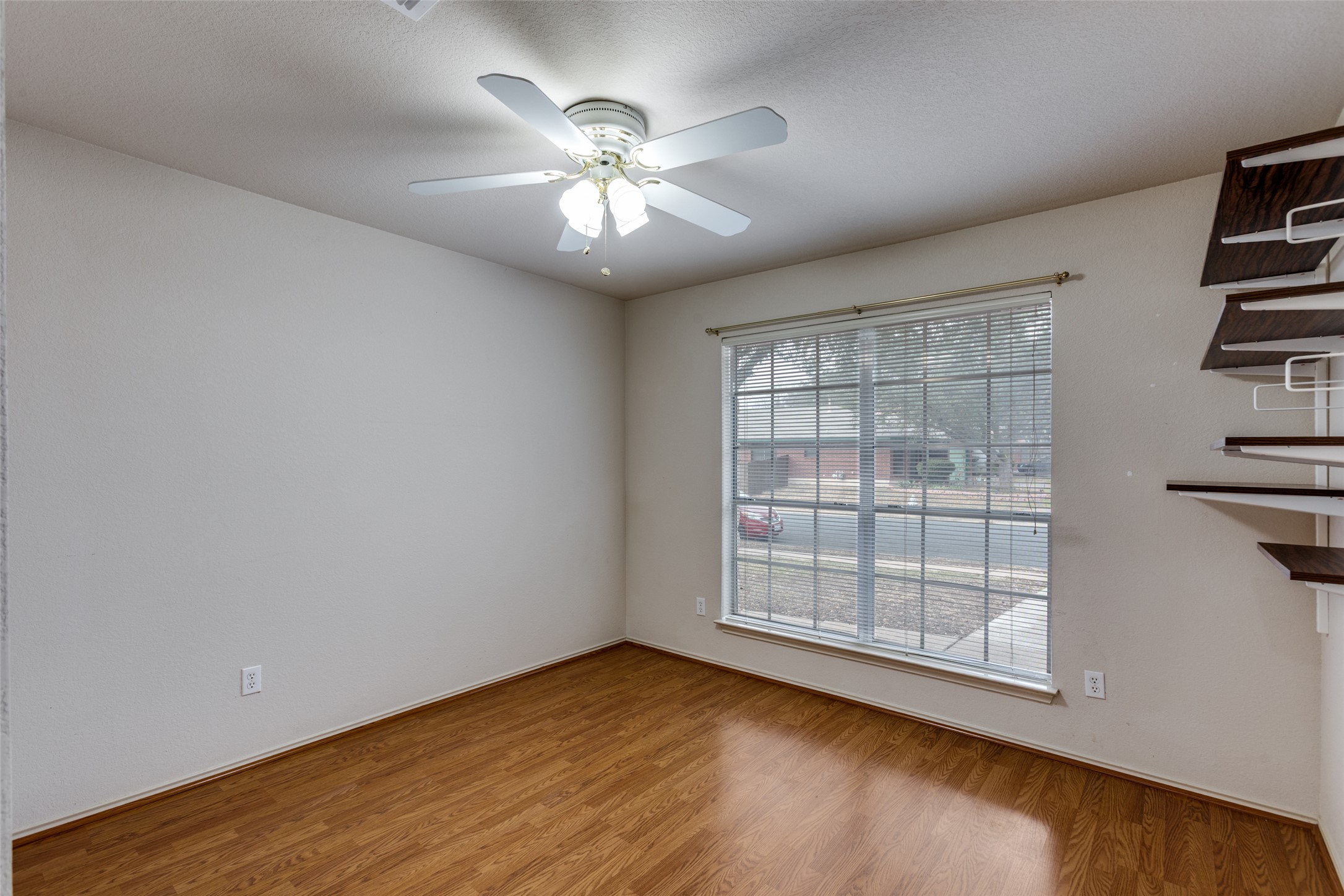 9057 Vigen Circle Austin, TX 78748 - Photo 21 of 27 wooden floor in an empty room with a window