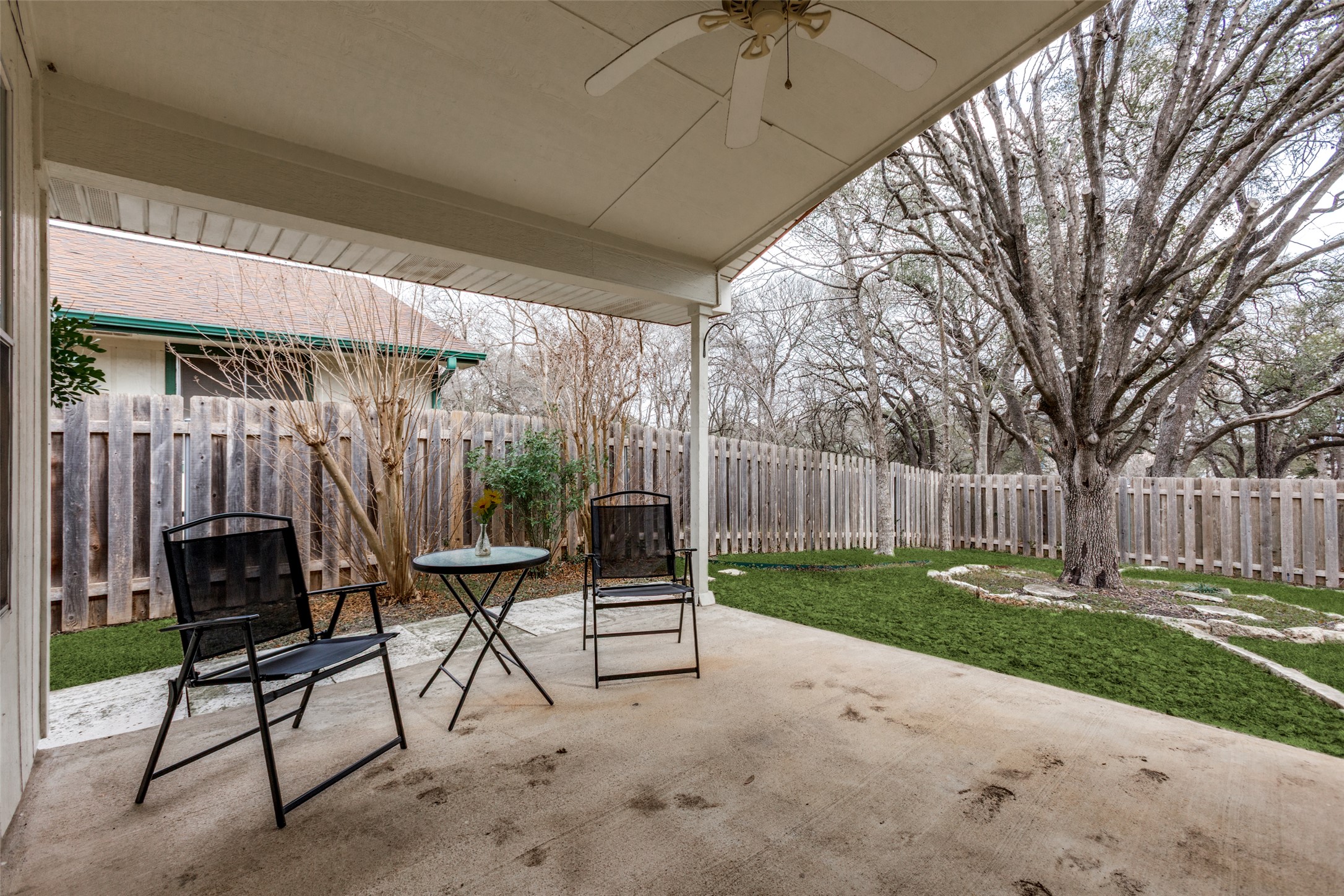 9057 Vigen Circle Austin, TX 78748 - Photo 24 of 27 a view of backyard with table and chairs and a large tree