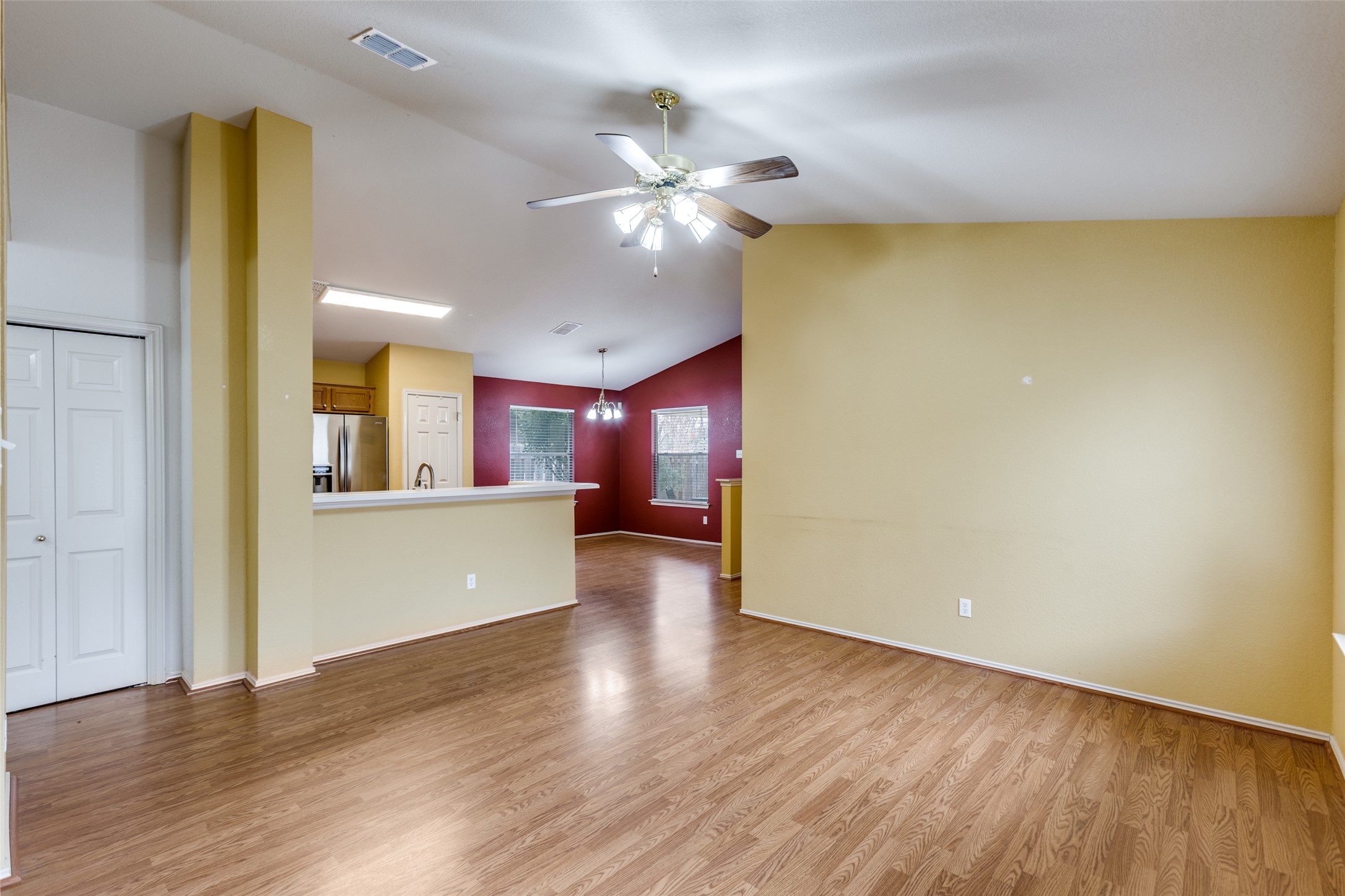 9057 Vigen Circle Austin, TX 78748 - Photo 4 of 27 a view of a livingroom with wooden floor and a ceiling fan