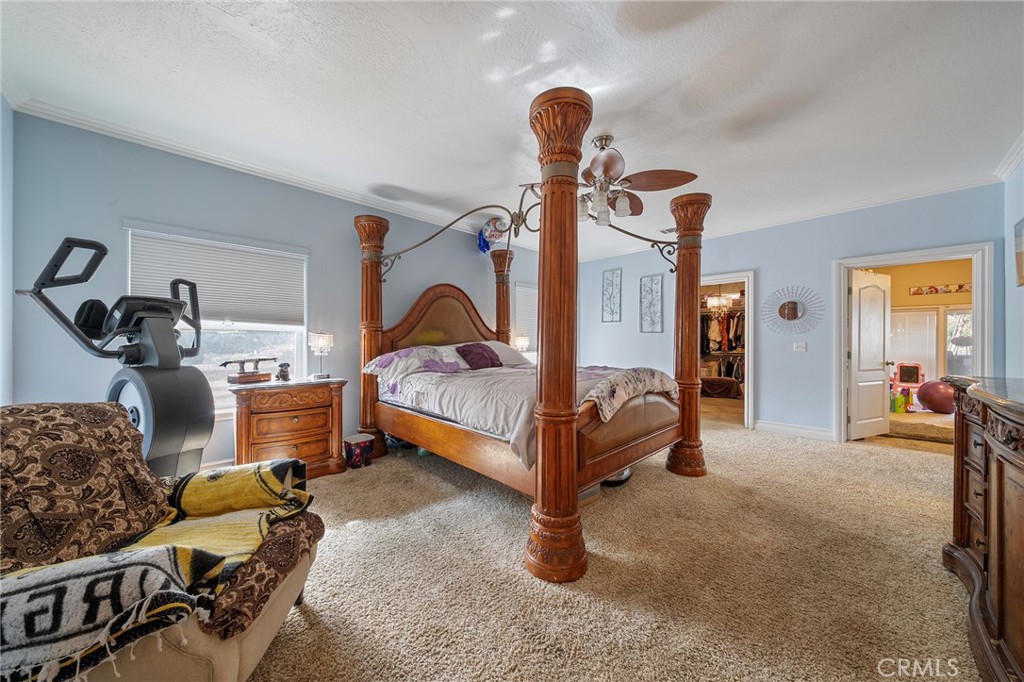 7172 Jargon Road Hesperia, CA 92344 - Photo 37 of 75 a bedroom with furniture and a chandelier