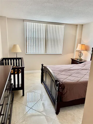 a view of a house with backyard porch and sitting area