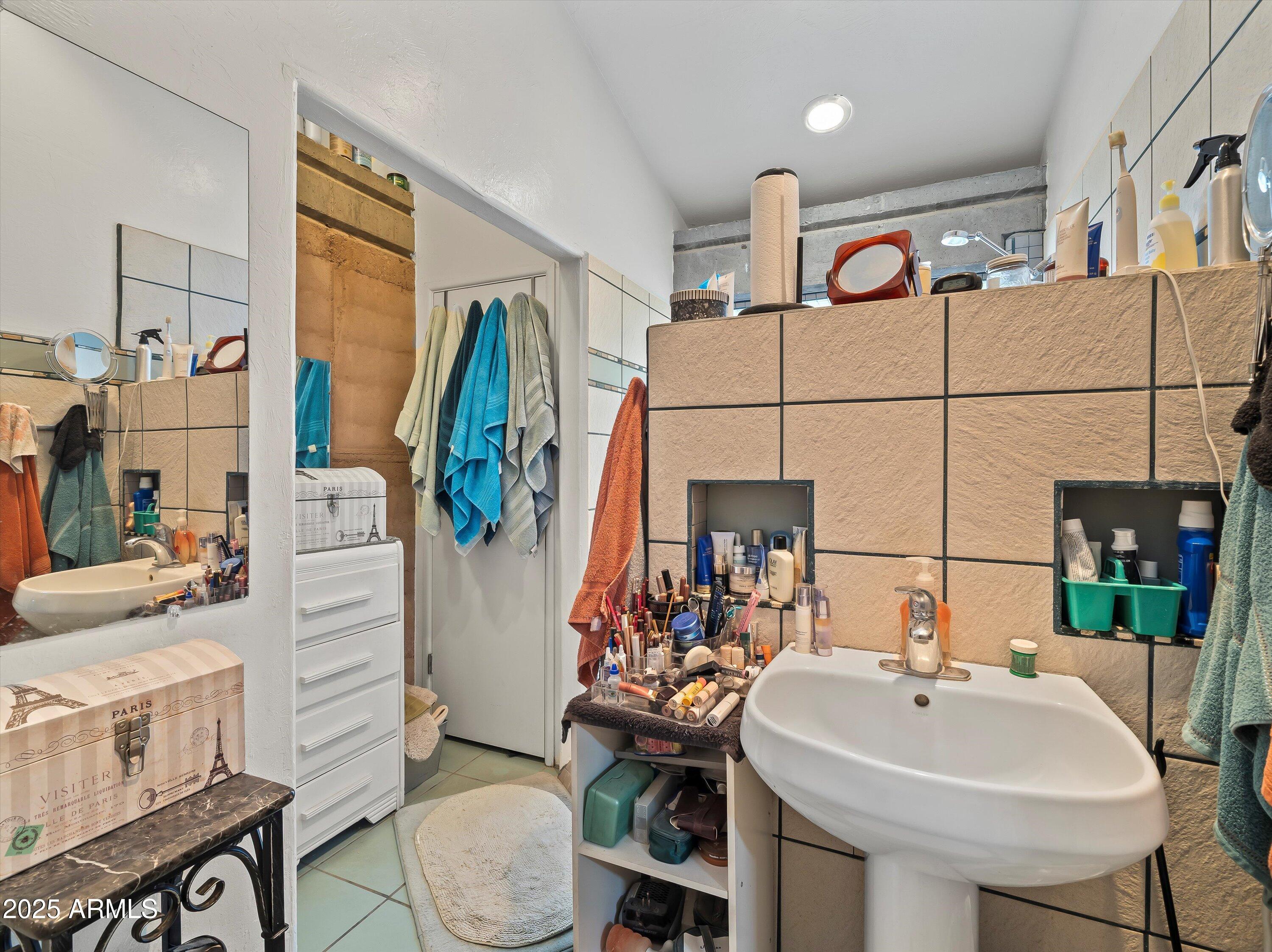 4489 North Ocotillo Road Benson, AZ 85602 - Photo 27 of 60 a bathroom with a sink a toilet and shower