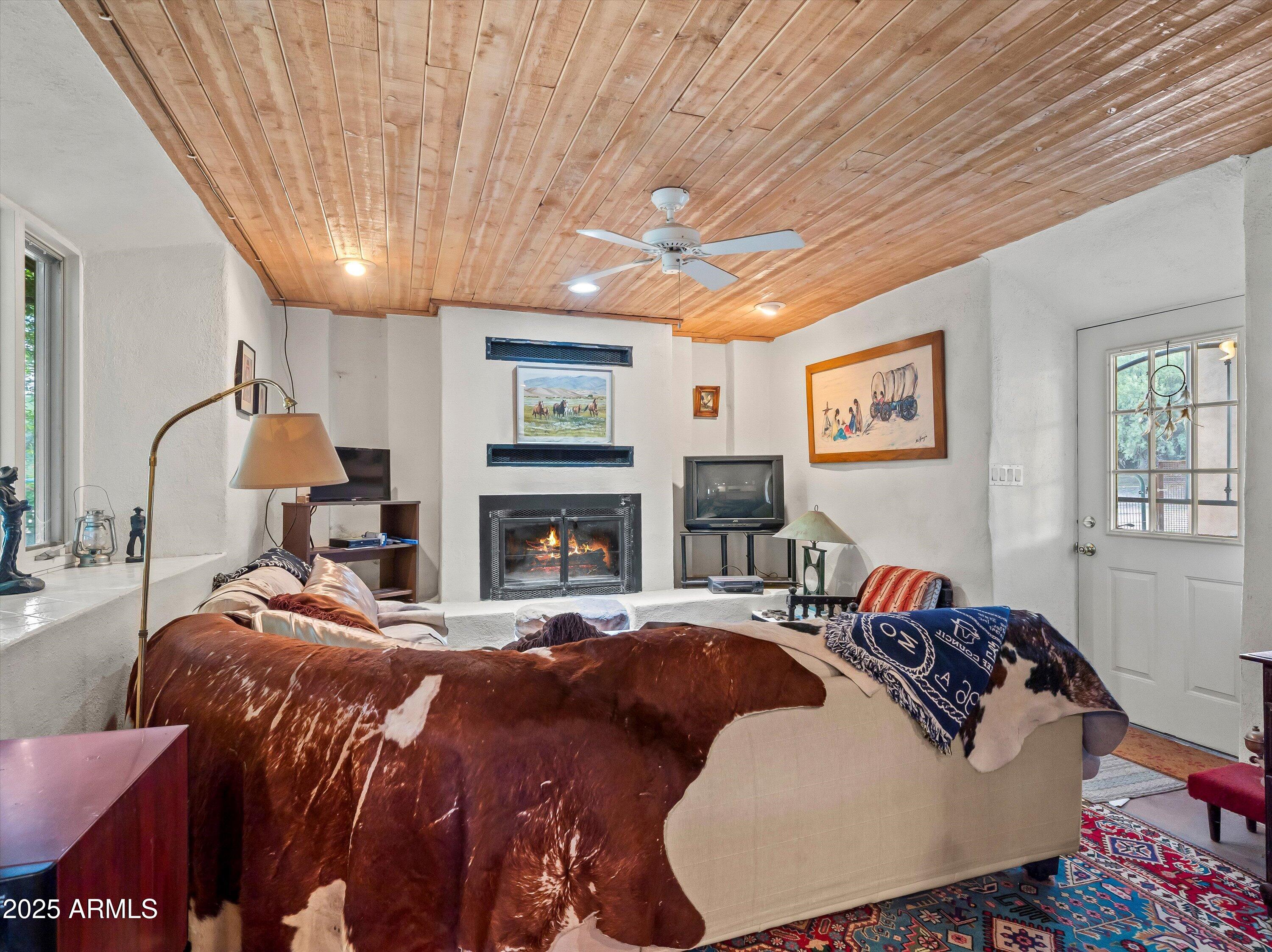 4489 North Ocotillo Road Benson, AZ 85602 - Photo 44 of 60 a bed room with a bed and a chair