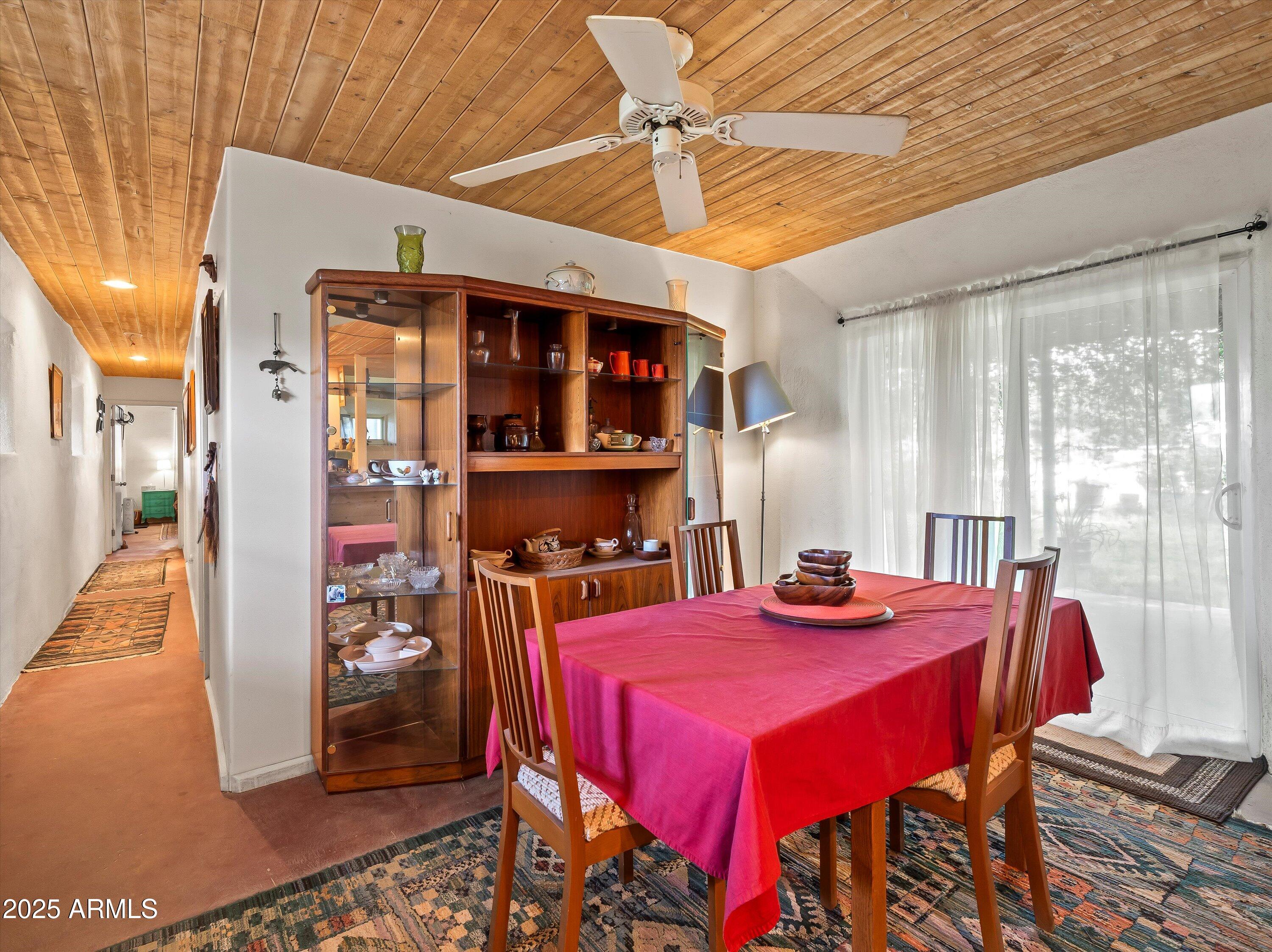 4489 North Ocotillo Road Benson, AZ 85602 - Photo 48 of 60 a view of a dining room with furniture and window