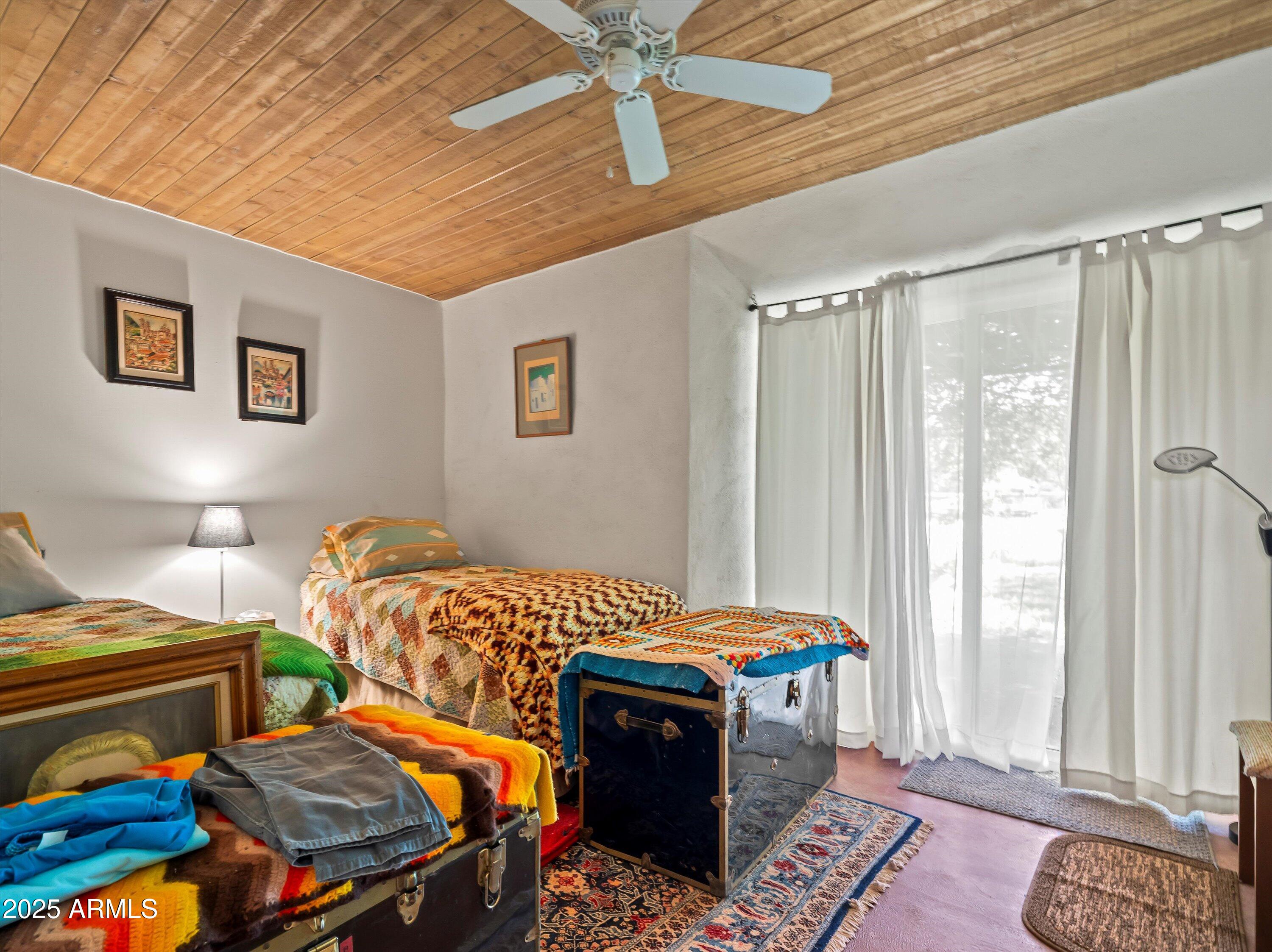 4489 North Ocotillo Road Benson, AZ 85602 - Photo 50 of 60 a bedroom with bed and a window