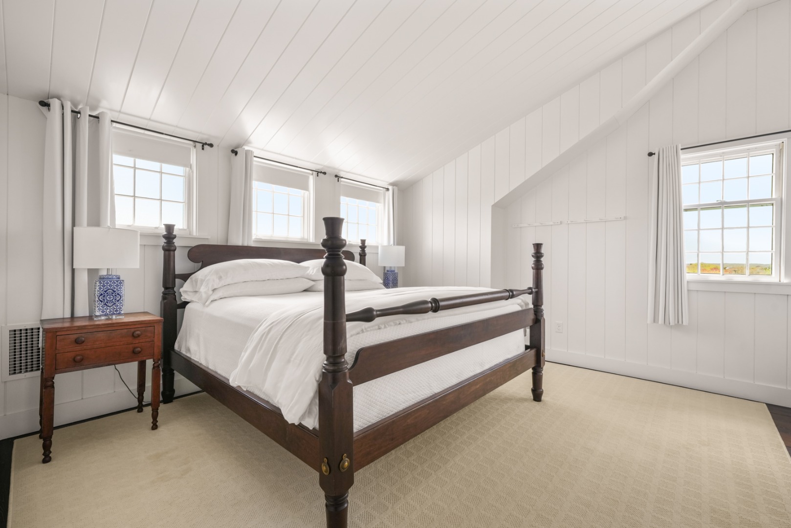 21 Quidnet Road Nantucket, MA 02554 - Photo 31 of 62 a bed room with a bed and a chair