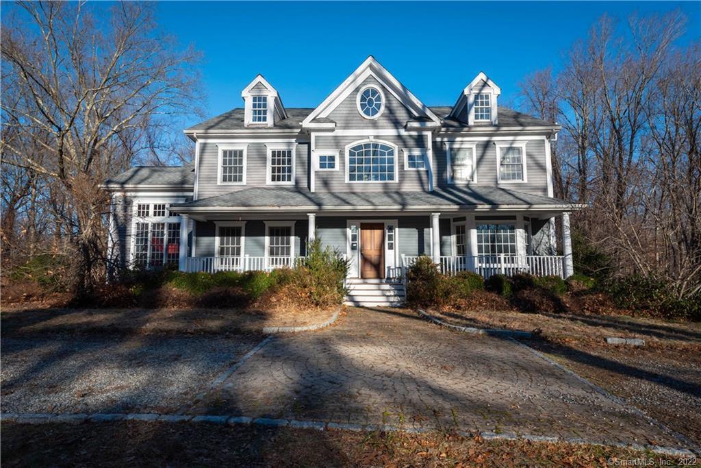71 Coley Road Wilton, CT 06897 - Photo 1 of 1 a front view of a house with a yard