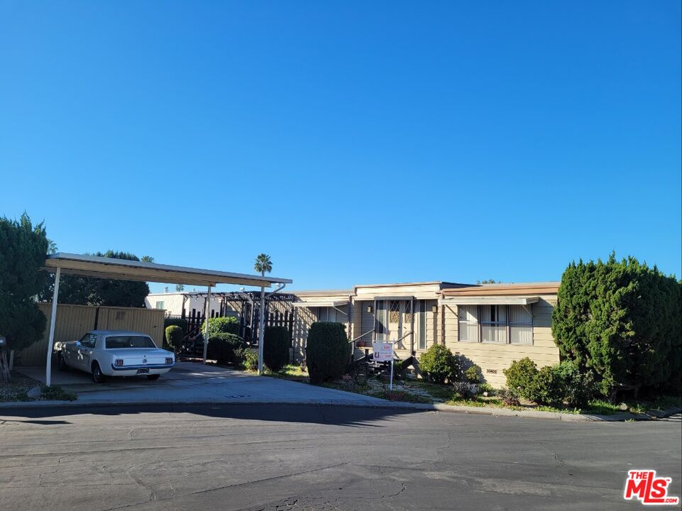 a view of a building and car parked