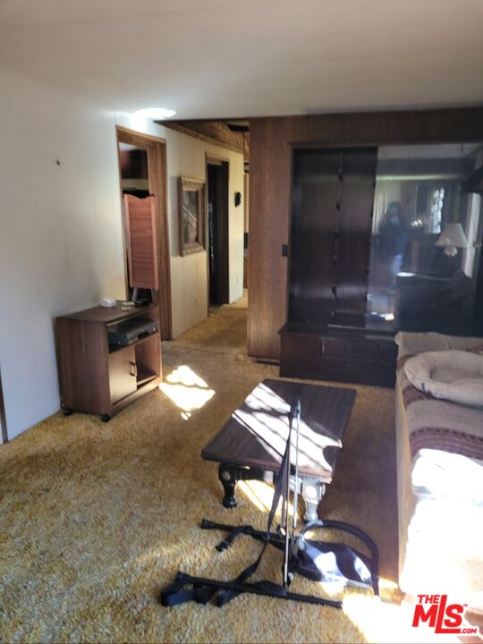 17700 South Avalon Boulevard, Unit 153 Carson, CA 90746 - Photo 14 of 17 a living room with couches chairs and kitchen view