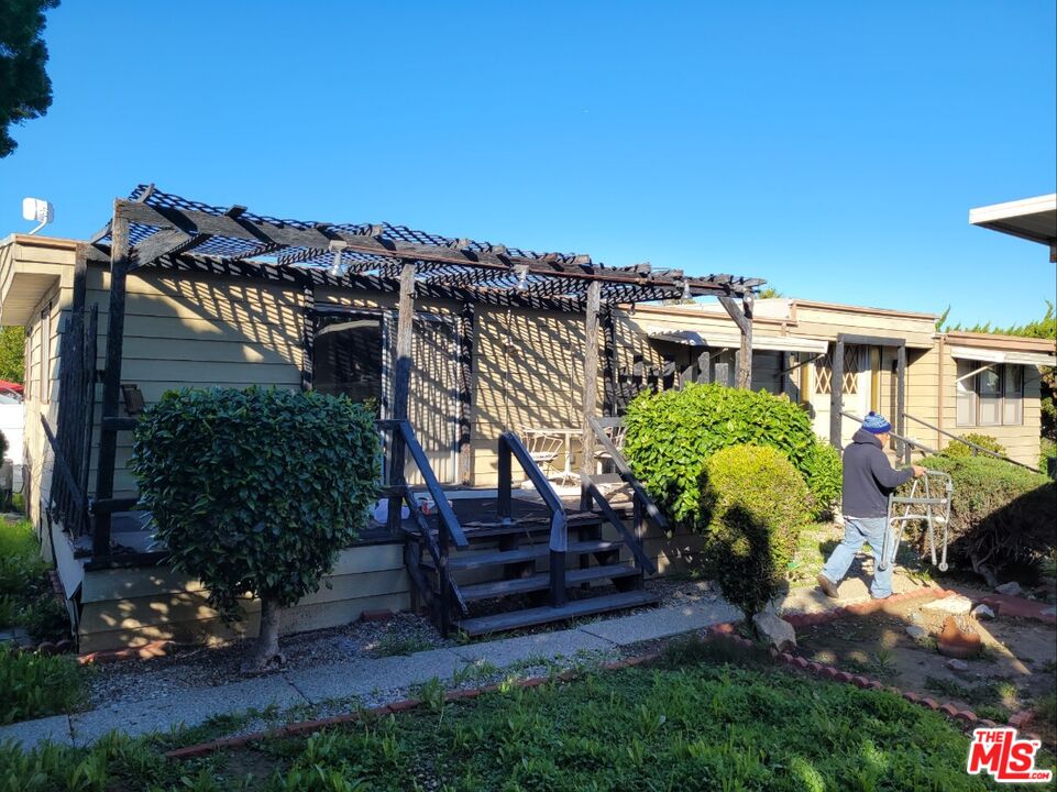 17700 South Avalon Boulevard, Unit 153 Carson, CA 90746 - Photo 4 of 17 a view of a house with a yard and garden