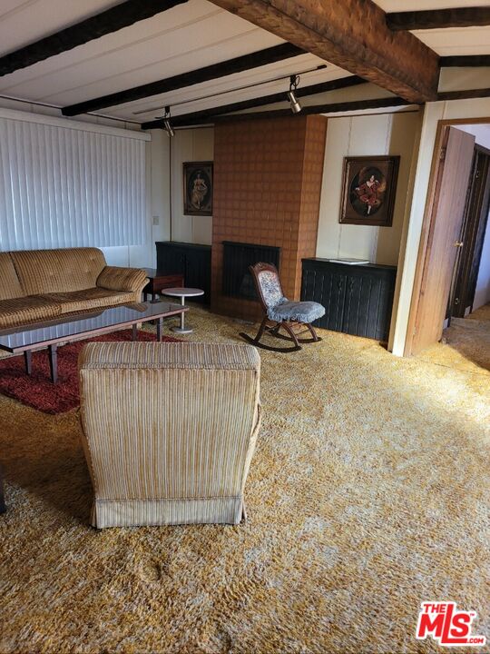 17700 South Avalon Boulevard, Unit 153 Carson, CA 90746 - Photo 6 of 17 a room with furniture and a fireplace