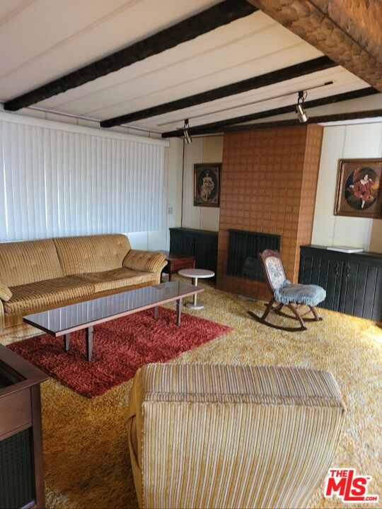 17700 South Avalon Boulevard, Unit 153 Carson, CA 90746 - Photo 8 of 17 a living room with furniture pool table and a fireplace