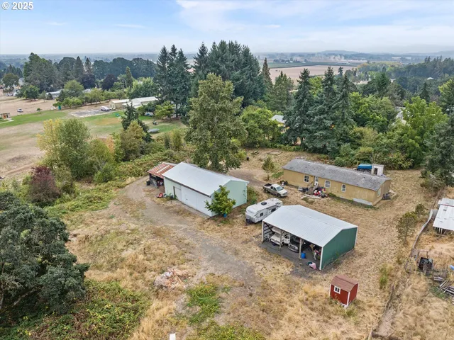 an aerial view of a house with outdoor space