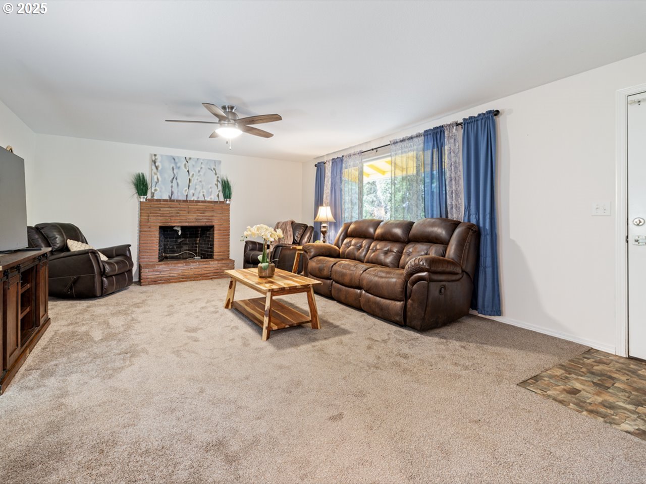 38115 Scravel Hill Road Northeast Albany, OR 97322 - Photo 5 of 46 a living room with furniture and a fireplace