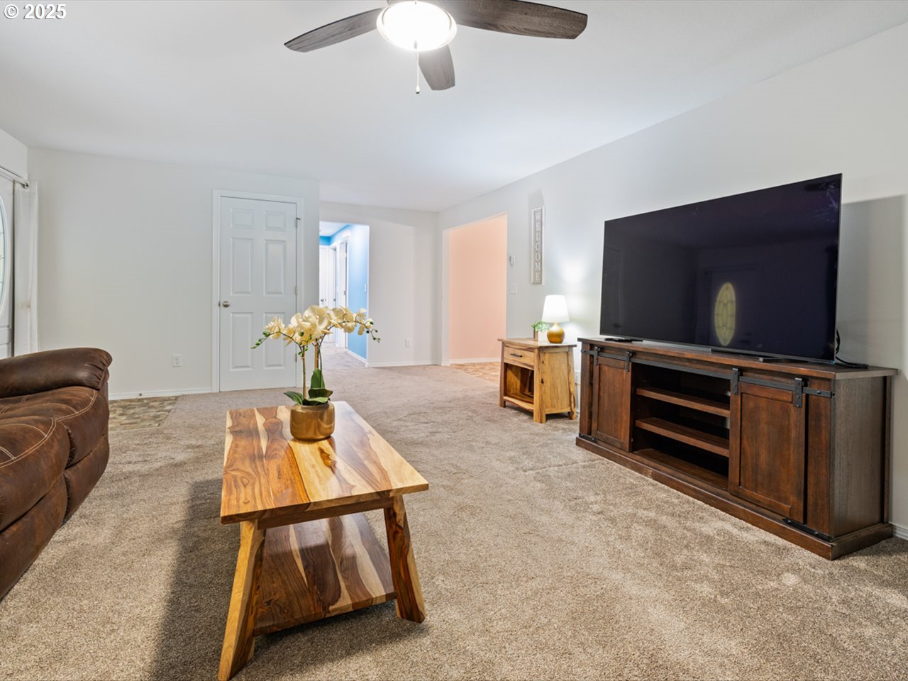 38115 Scravel Hill Road Northeast Albany, OR 97322 - Photo 6 of 46 a living room with furniture and a flat screen tv