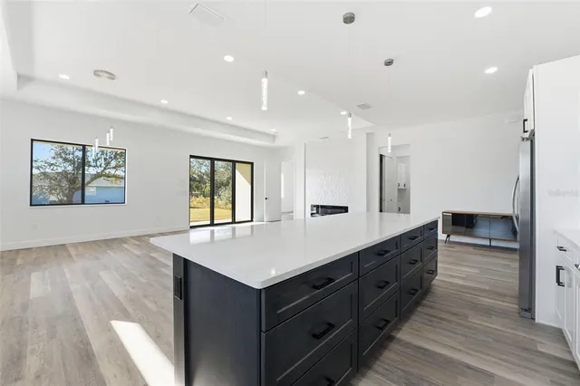 a large bathroom with a sink and a large mirror