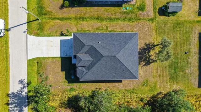 an aerial view of residential houses with city view