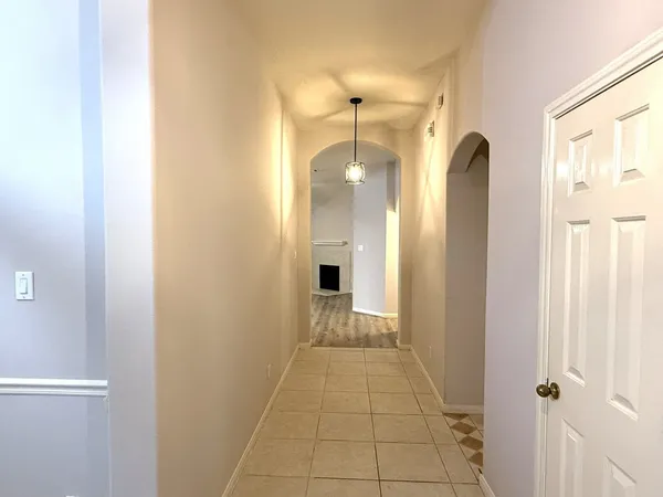 a view of a bathroom with a shower and a mirror