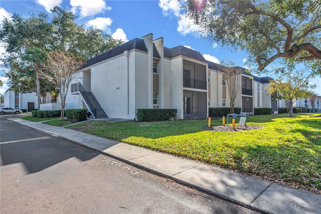 801 Russell Lane, Unit 255 Brandon, FL 33510 - Photo 1 of 22 a view of a house with a yard and large tree