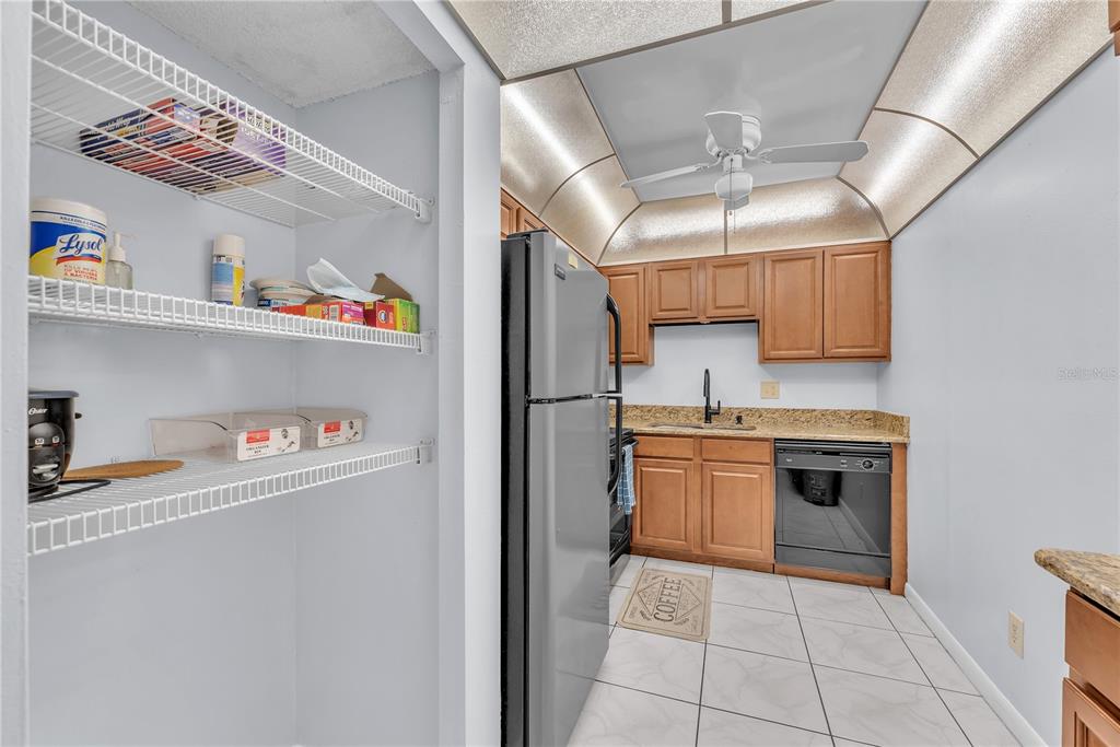 801 Russell Lane, Unit 255 Brandon, FL 33510 - Photo 11 of 22 a kitchen with stainless steel appliances granite countertop a refrigerator and a sink