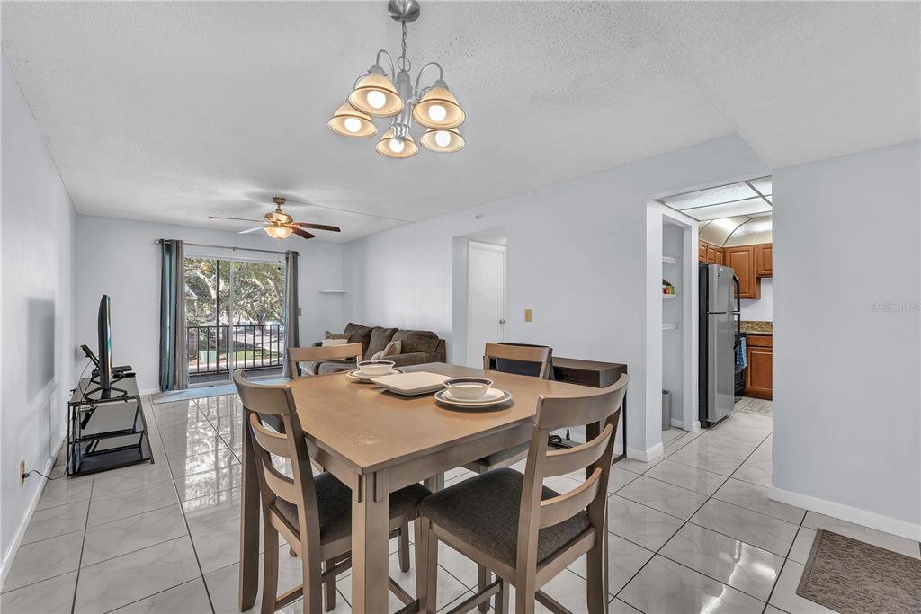 801 Russell Lane, Unit 255 Brandon, FL 33510 - Photo 18 of 22 a view of a dining room with furniture window and wooden floor