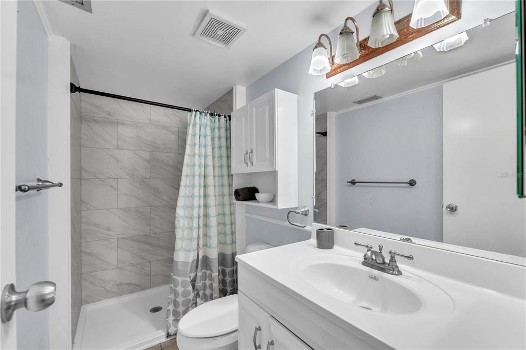 801 Russell Lane, Unit 255 Brandon, FL 33510 - Photo 5 of 22 a bathroom with a sink toilet and shower