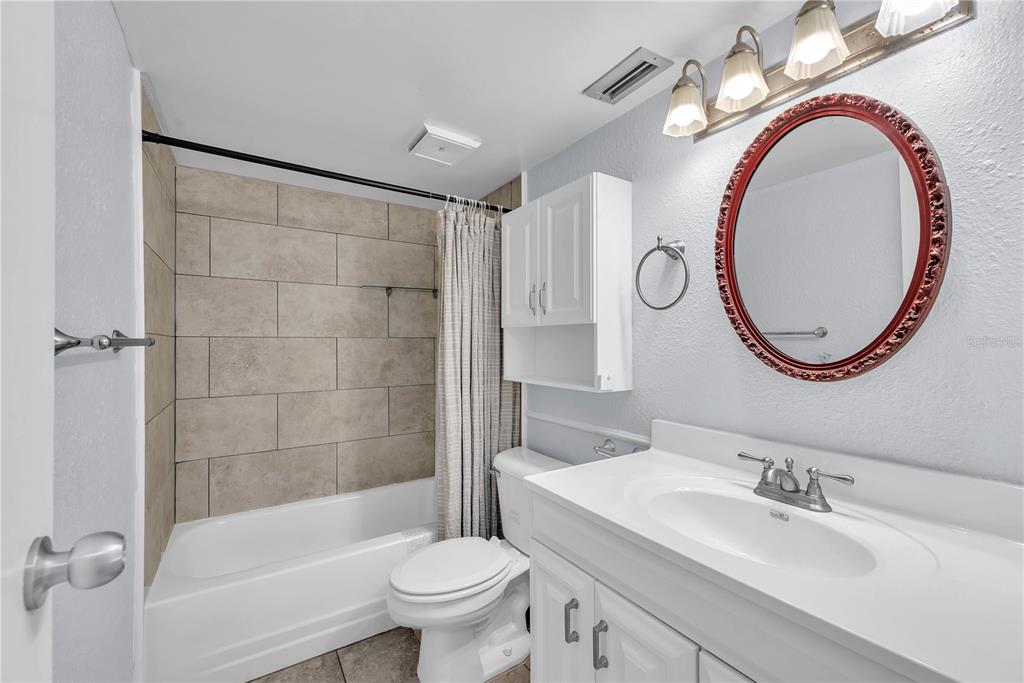801 Russell Lane, Unit 255 Brandon, FL 33510 - Photo 7 of 22 a bathroom with a sink a toilet and a mirror