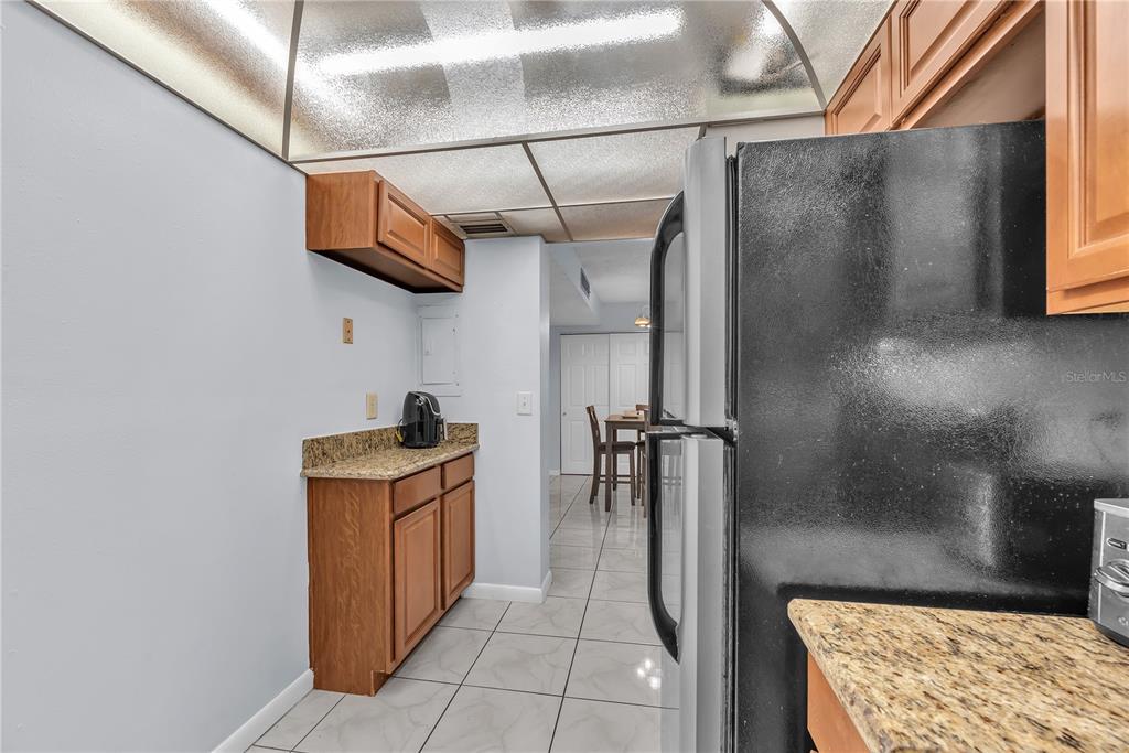 801 Russell Lane, Unit 255 Brandon, FL 33510 - Photo 8 of 22 a kitchen with stainless steel appliances granite countertop a sink and a stove