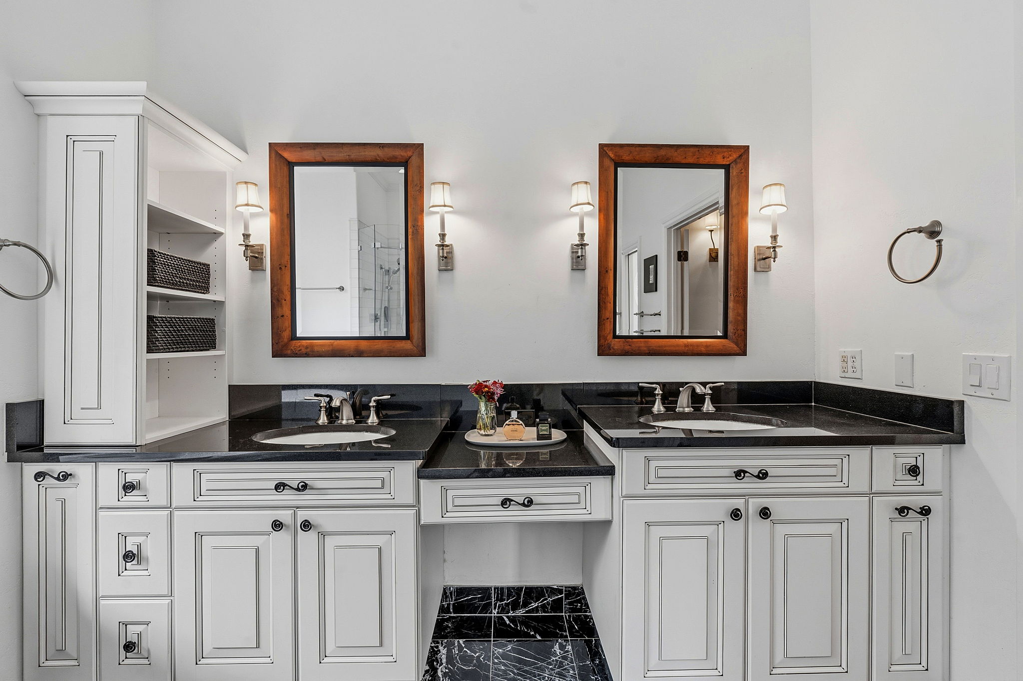 8121 Bluff Trail Austin, TX 78737 - Photo 26 of 40 Dual vanities with rich granite counters and custom cabinetry elevate this well-appointed bathroom.