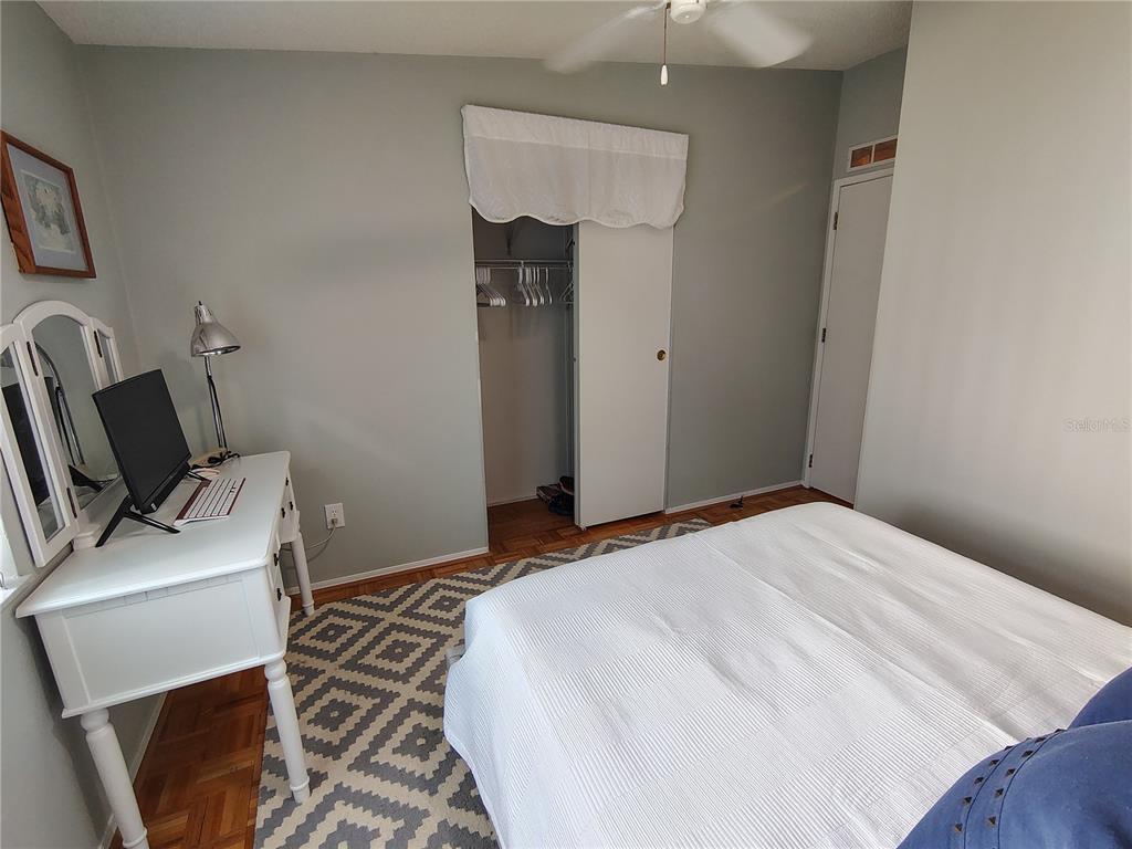 116 Lyonia Lane Wildwood, FL 34785 - Photo 22 of 37 a bedroom with a bed and a chair