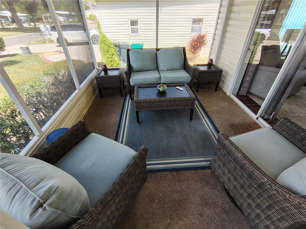 116 Lyonia Lane Wildwood, FL 34785 - Photo 25 of 37 a balcony with furniture and a window