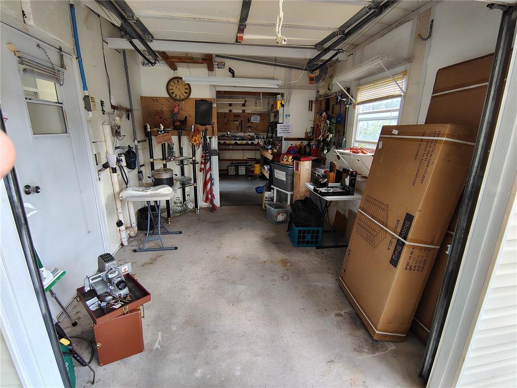 116 Lyonia Lane Wildwood, FL 34785 - Photo 27 of 37 a view of a storage room with washer and dryer