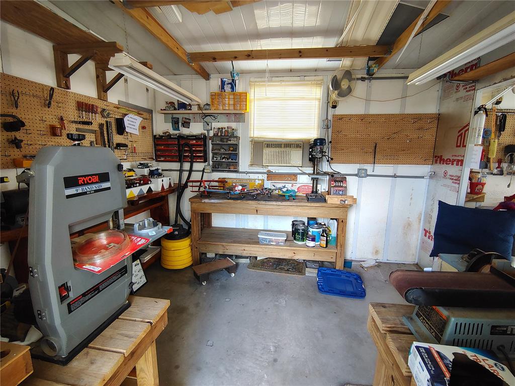 116 Lyonia Lane Wildwood, FL 34785 - Photo 28 of 37 a room with lots of books and chairs