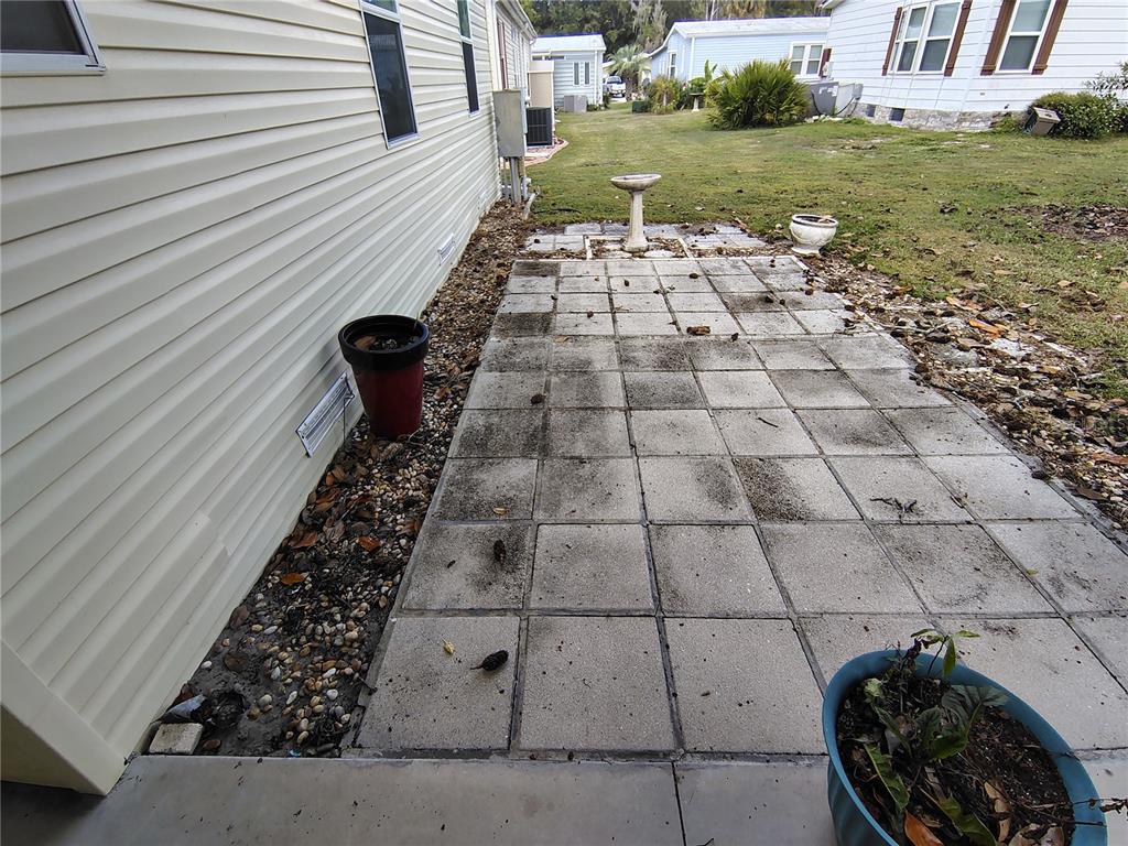 116 Lyonia Lane Wildwood, FL 34785 - Photo 29 of 37 a view of a backyard with sitting area